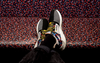 colorful seat pattern, train, white sneaker with details, black and white striped